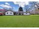 Charming single-story home with a well-maintained lawn and inviting curb appeal on a bright day at 7859 Jennifer Ln, Brownsburg, IN 46112