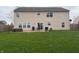 Expansive backyard featuring a patio, outdoor seating, and a large grassy area, perfect for leisure and gatherings at 796 Booneway Ln, Bargersville, IN 46106
