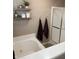Bright bathroom featuring a large soaking tub, a glass-enclosed shower, and stylish decor for a relaxing experience at 796 Booneway Ln, Bargersville, IN 46106