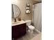 Cozy bathroom features a modern sink, shelving, and a stylish striped shower curtain at 796 Booneway Ln, Bargersville, IN 46106