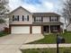 Charming two-story home features a spacious driveway and manicured lawn at 796 Booneway Ln, Bargersville, IN 46106