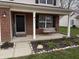 Inviting front porch with a swing, stone border, and lovely landscaping at 796 Booneway Ln, Bargersville, IN 46106