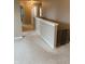 Well-lit hallway with neutral paint, white trim, plush carpet, and a safety gate at the top of the stairs at 796 Booneway Ln, Bargersville, IN 46106