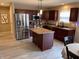 Modern kitchen with stainless steel appliances, an island, and custom cabinetry at 796 Booneway Ln, Bargersville, IN 46106
