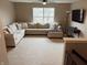 A living room with a large sectional sofa, a view of the outdoors, and a ceiling fan at 796 Booneway Ln, Bargersville, IN 46106