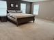 Spacious main bedroom with a dark accent wall, plush carpeting, and a comfortable queen-sized bed at 796 Booneway Ln, Bargersville, IN 46106