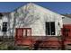 The backyard features a red deck, siding, and manicured lawn for outdoor enjoyment at 8219 Lake Tree Ln, Indianapolis, IN 46217