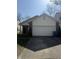 Traditional-style home with a two-car garage and brick and siding facade at 8219 Lake Tree Ln, Indianapolis, IN 46217