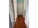 Hallway with multiple doors and laminate flooring at 8219 Lake Tree Ln, Indianapolis, IN 46217