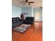 Cozy living room featuring sleek, dark sofas and a decorative rug at 8219 Lake Tree Ln, Indianapolis, IN 46217