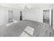 Large bedroom with carpet flooring, open doorways and natural light at 8251 Garden Ridge Rd, Indianapolis, IN 46237