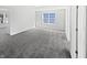 Bedroom with neutral carpet, natural light from a window, and adjoining rooms at 8251 Garden Ridge Rd, Indianapolis, IN 46237