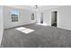 Spacious bedroom with abundant natural light, modern light fixture and plush carpeting at 8251 Garden Ridge Rd, Indianapolis, IN 46237