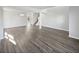 Spacious living room featuring hardwood floors, neutral paint, and staircase to upper floors at 8251 Garden Ridge Rd, Indianapolis, IN 46237