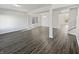 Open living room with hardwood floors and natural light through windows at 8251 Garden Ridge Rd, Indianapolis, IN 46237