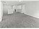 Loft area with neutral carpet and multiple entryways at 8251 Garden Ridge Rd, Indianapolis, IN 46237