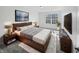 Well-lit main bedroom featuring a modern bed frame and stylish decor, creating a comfortable atmosphere at 8251 Garden Ridge Rd, Indianapolis, IN 46237