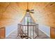 Bright attic space with custom woodwork, a spiral staircase and natural light from the sliding door at 8394 S 600 W, Pendleton, IN 46064