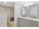 Modern bathroom with double sink vanity, decorative tile backsplash, and a walk-in shower with built-in seating at 8394 S 600 W, Pendleton, IN 46064