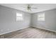 This bedroom has hardwood floors and natural lighting from the large window with white trim at 8394 S 600 W, Pendleton, IN 46064