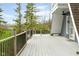 Expansive deck featuring wood railings overlooking a beautifully landscaped yard at 8394 S 600 W, Pendleton, IN 46064