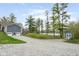 Charming blue home with a two-car garage, shed, and a gravel driveway, nestled near a serene lake at 8394 S 600 W, Pendleton, IN 46064