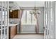 Eat-in kitchen with classic wood cabinetry, modern lighting, and large windows at 8394 S 600 W, Pendleton, IN 46064