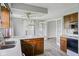 Bright, open kitchen featuring wooden cabinetry, neutral countertops, and modern appliances at 8394 S 600 W, Pendleton, IN 46064