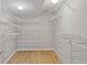 Walk-in closet with custom shelving and racks for clothes and accessories at 8394 S 600 W, Pendleton, IN 46064