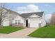Inviting single-story home with a one-car garage, complemented by a well-kept lawn and a paved driveway at 8529 Sansa St, Camby, IN 46113