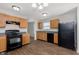 Modern kitchen featuring sleek black appliances, ample cabinet space, and a contemporary design at 8529 Sansa St, Camby, IN 46113