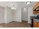 Well-lit kitchen space with modern lighting and a smooth transition to an adjoining dining room at 8529 Sansa St, Camby, IN 46113