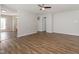 Expansive living room featuring wood-look floors, neutral walls, and an open layout at 8529 Sansa St, Camby, IN 46113