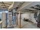 View of the unfinished basement with exposed utilities, concrete floor and some clutter at 922 Cottage Ave, Indianapolis, IN 46203