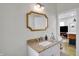 Elegant bathroom featuring a vanity with granite countertop and stylish faucet, creating a sophisticated look at 922 Cottage Ave, Indianapolis, IN 46203