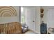 Charming Bedroom with crib, changing table, and colorful decor, creating a warm and inviting atmosphere at 922 Cottage Ave, Indianapolis, IN 46203