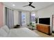 Bright bedroom with a ceiling fan, and large windows at 922 Cottage Ave, Indianapolis, IN 46203