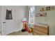 Bright Bedroom featuring a toy corner, changing table, and cheerful decor, designed for comfort and play at 922 Cottage Ave, Indianapolis, IN 46203