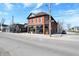 Attractive red brick building with storefront windows, positioned on a corner lot at 922 Cottage Ave, Indianapolis, IN 46203