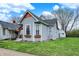 Gray home with window boxes, landscaped yard, and lots of curb appeal at 922 Cottage Ave, Indianapolis, IN 46203