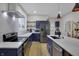 Bright kitchen with stainless steel appliances, a large island, and plenty of counter space at 922 Cottage Ave, Indianapolis, IN 46203