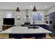 A kitchen featuring an island with sink, stainless steel appliances, and modern cabinetry at 922 Cottage Ave, Indianapolis, IN 46203