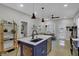 Open concept kitchen with a large kitchen island and modern lighting at 922 Cottage Ave, Indianapolis, IN 46203