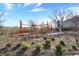 Community playground construction with colorful equipment and landscaping beginning to bloom at 922 Cottage Ave, Indianapolis, IN 46203