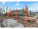 New community playground featuring colorful play equipment under construction at 922 Cottage Ave, Indianapolis, IN 46203