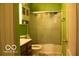 Compact bathroom featuring a shower-tub combo, vanity, and updated fixtures at 10105 Yosemite Ln, Indianapolis, IN 46234