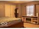 Comfortable bedroom featuring neutral tones, a cozy bed, and window with natural light at 10105 Yosemite Ln, Indianapolis, IN 46234