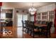 Well-lit dining room with large table and chairs, adjacent to kitchen at 10105 Yosemite Ln, Indianapolis, IN 46234