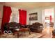Cozy living room with hardwood floors, ornate furniture, and bright window at 10105 Yosemite Ln, Indianapolis, IN 46234