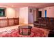 Spacious living room with a plush red rug, comfortable seating, and ample space at 10105 Yosemite Ln, Indianapolis, IN 46234